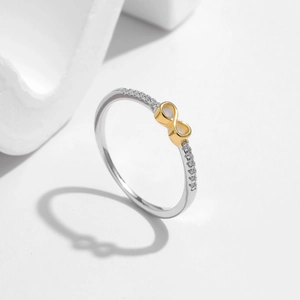 Minimalist S925 silver infinity ring with gold accent and delicate pavé diamonds