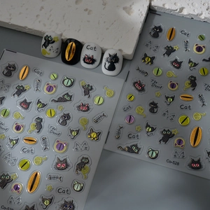 3D black cat nail art stickers featuring fishbone and starry moon designs on grey base