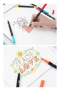Detailed view of dual tip art markers used for coloring cartoon art and floral lettering