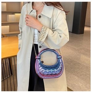 Detail shot of purple gradient acrylic handbag with 3D geometric quilted pattern and round handle