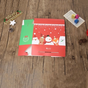Christmas gift boxes with Santa and reindeer illustrations on vintage wood background