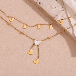 Detail of 18K gold-plated double-layer anklet with white shell heart-shaped pendant