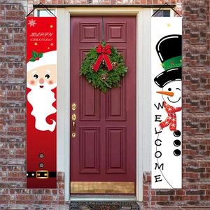 Christmas door banner set featuring Santa and Snowman hanging on a red festive front door