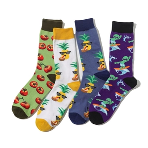 Flat lay of colorful cotton crew socks featuring tomato and pineapple fruit patterns