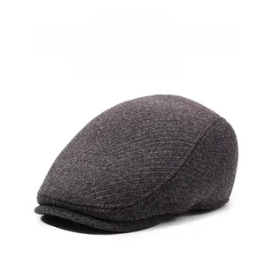Detailed texture of thick wool fabric and ear protection flap on a winter flat cap