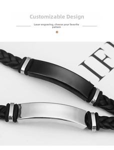 Close-up of braided leather bracelet with matte black and silver steel ID plates
