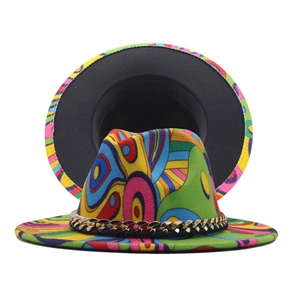 Detail of artistic graffiti fedora hat featuring colorful abstract patterns and gold metal chain