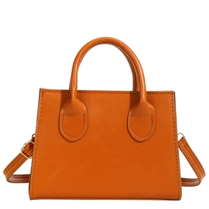 Classic orange square handbag for women with dual top handles and detachable shoulder strap