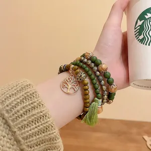 Bohemian multi-layer sandalwood bead bracelet with Tree of Life charm and green tassel