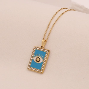 Collier en acier doré avec pendentif œil maléfique en émail bleu et oxydes de zirconium