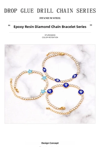 Detail of 18K gold-plated titanium steel tennis bracelet with blue evil eye charms