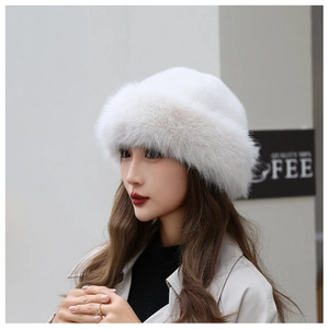 Detail view of plush white faux fur winter hat with long dense fibers for warmth