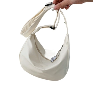 Large capacity white dumpling crossbody bag with adjustable strap and cute sheep pendant