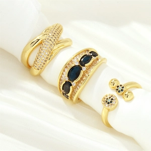 Luxurious 18K gold plated X-shaped crisscross rings with blue sapphire and zircon stones