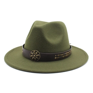 Close-up of army green wool fedora with leather band and vintage metal ornament