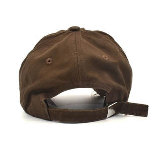 Detail of dark brown cotton baseball cap back with adjustable metal buckle strap