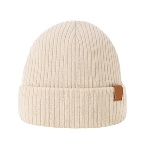 Thick ribbed knit beanie hat in cream white with a brown leather decorative side tag