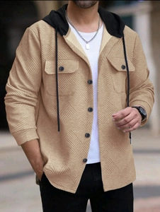Detail of khaki jacquard fabric on men's hooded jacket with buttons and chest pockets