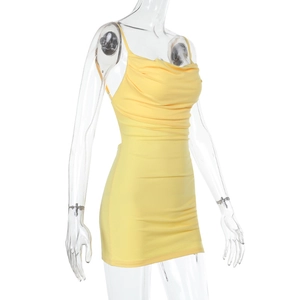 Detail view of the yellow mini bodycon dress with cowl neck and ruched texture