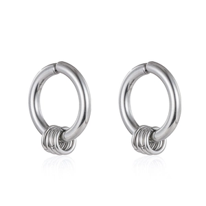 Close-up of silver stainless steel hoop earrings with nested small rings on white background