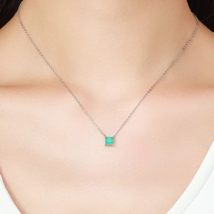 Elegant S925 sterling silver necklace with a square emerald gemstone on model