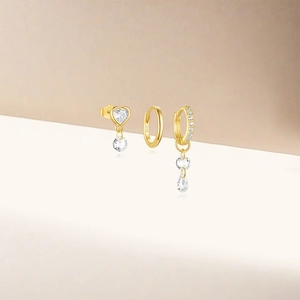 Detailed close-up of S925 sterling silver gold earring set with zircon charms