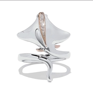 Polished silver and rose gold manta ray open ring with pavé stones on white background
