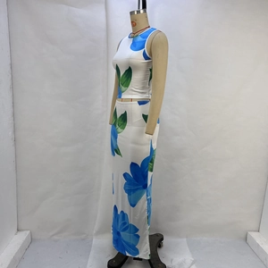 Detail view of the floral print on a white summer crop top and long skirt set for women
