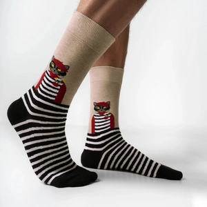 Detail of crew socks featuring a cat with a red beret and striped pattern design