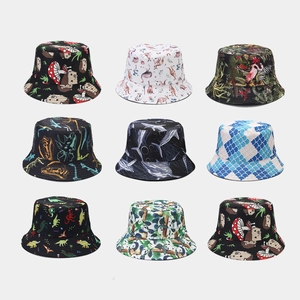 Collection of reversible bucket hats with cute cartoon animal prints and various patterns