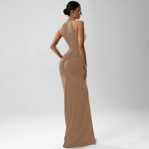 Detail of the back pleats and zipper on a brown halter neck backless maxi dress