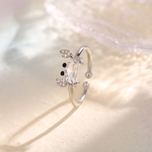 Macro detail of silver crab ring featuring a polished crystal body and sparkling claw accents
