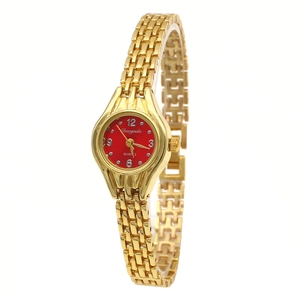 Detailed close-up of a gold metal watch strap and a vibrant red dial with quartz movement