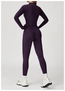 Rear view of tight dark purple yoga bodysuit showing slim fit and stretch fabric