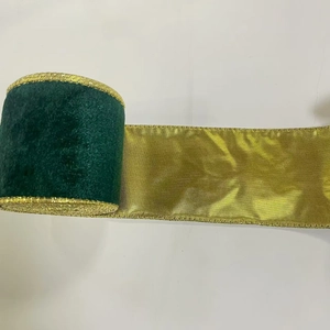 Detail of Christmas ribbon showing dark green velvet and gold satin with metallic wire edges