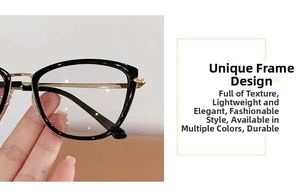 Detail of cat-eye glasses with black frames and golden metal temples held in hand