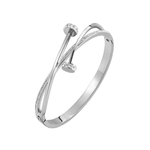 Macro detail of silver titanium steel nail bracelet with sparkling pavé crystals