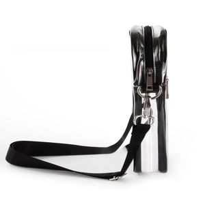 Detail view of silver mirror PVC crossbody bag with black trim and adjustable strap