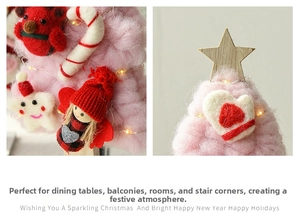 Close-up of handmade felt Christmas tree ornaments with glowing warm lights