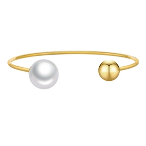 Minimalist gold stainless steel open bangle featuring a white pearl and polished gold bead