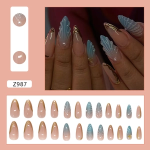 Blue gradient almond press-on nails with 3D seashells, pearls, and gold edge accents