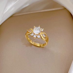 Adjustable gold flower ring featuring a large round zircon and sparkling pavé petals