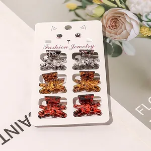 Set of 6 leopard print resin hair claws on a fashion display card for styling
