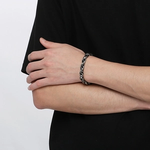 Close-up of vintage silver industrial chain link bracelet worn on a male wrist