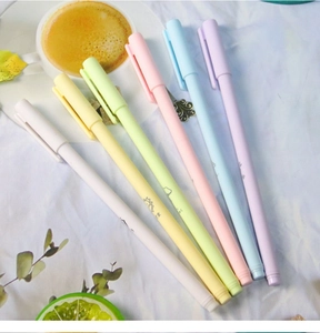 Detailed view of 6 Morandi color gel pens set on a desk with a cozy lifestyle background
