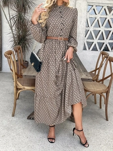 Elegant vintage geometric print long sleeve maxi dress with brown belt in a garden