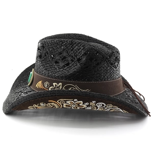 Detail of black straw cowboy hat featuring floral embroidery and turquoise decorative stud