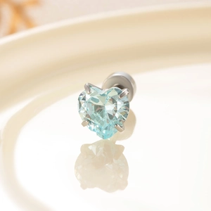 Surgical steel stud earring featuring a heart-shaped light blue zircon in 4-prong setting