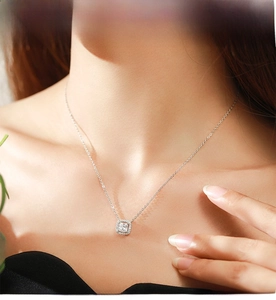 Close-up of S925 sterling silver halo necklace with square-cut sparkling zircon on neck