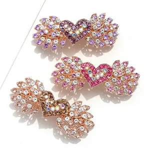 Fermagli per capelli con strass a forma di cuore e ali in viola, rosa e champagne
